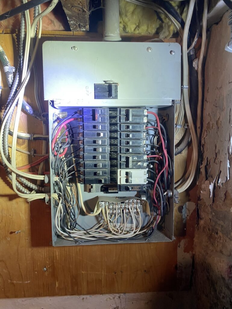 Old 60 amp electrical panel before upgrade in Mississauga home