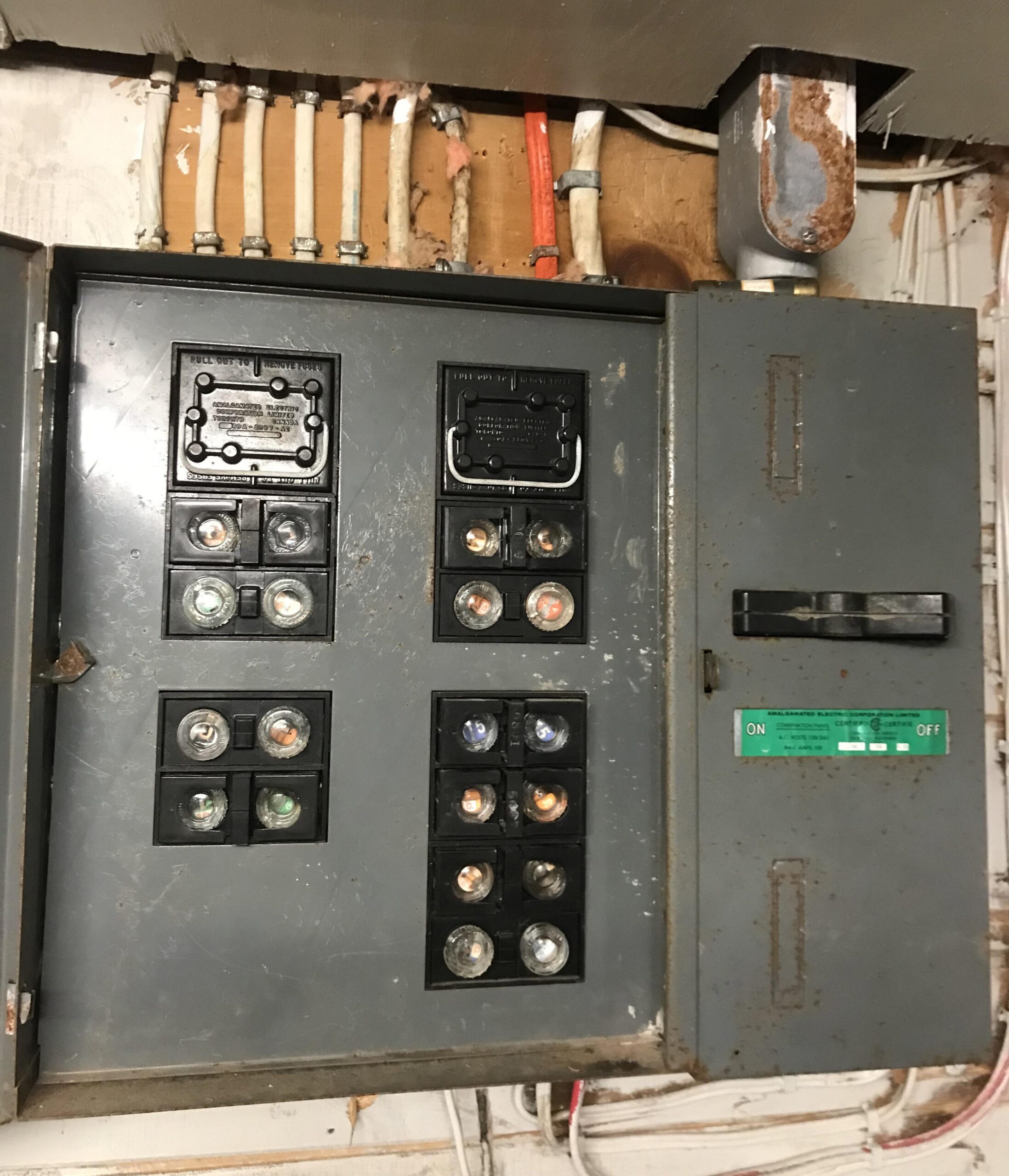 Older residential fuse panel before replacement in Mississauga